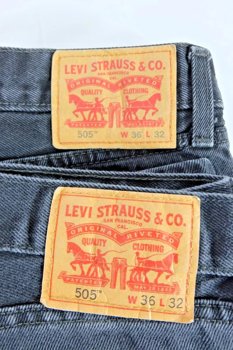 Two Levi&rsquo;s 505 back patches on dark denim