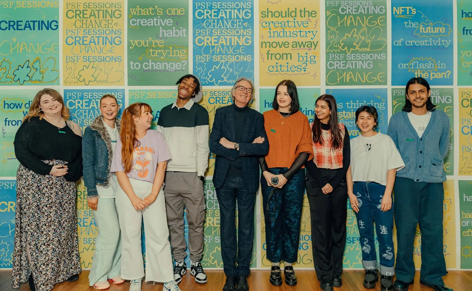 Paul Smith with PSF Sessions London attendees in front of the printed poster wall
